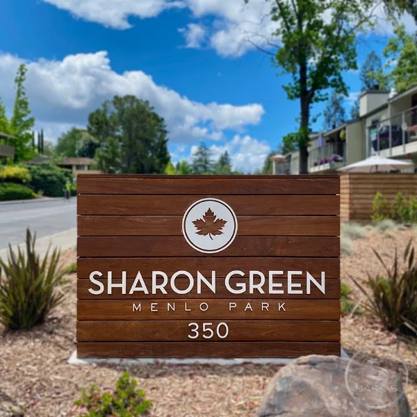 Freestanding Sharon Green monument sign with horizontal wood panels