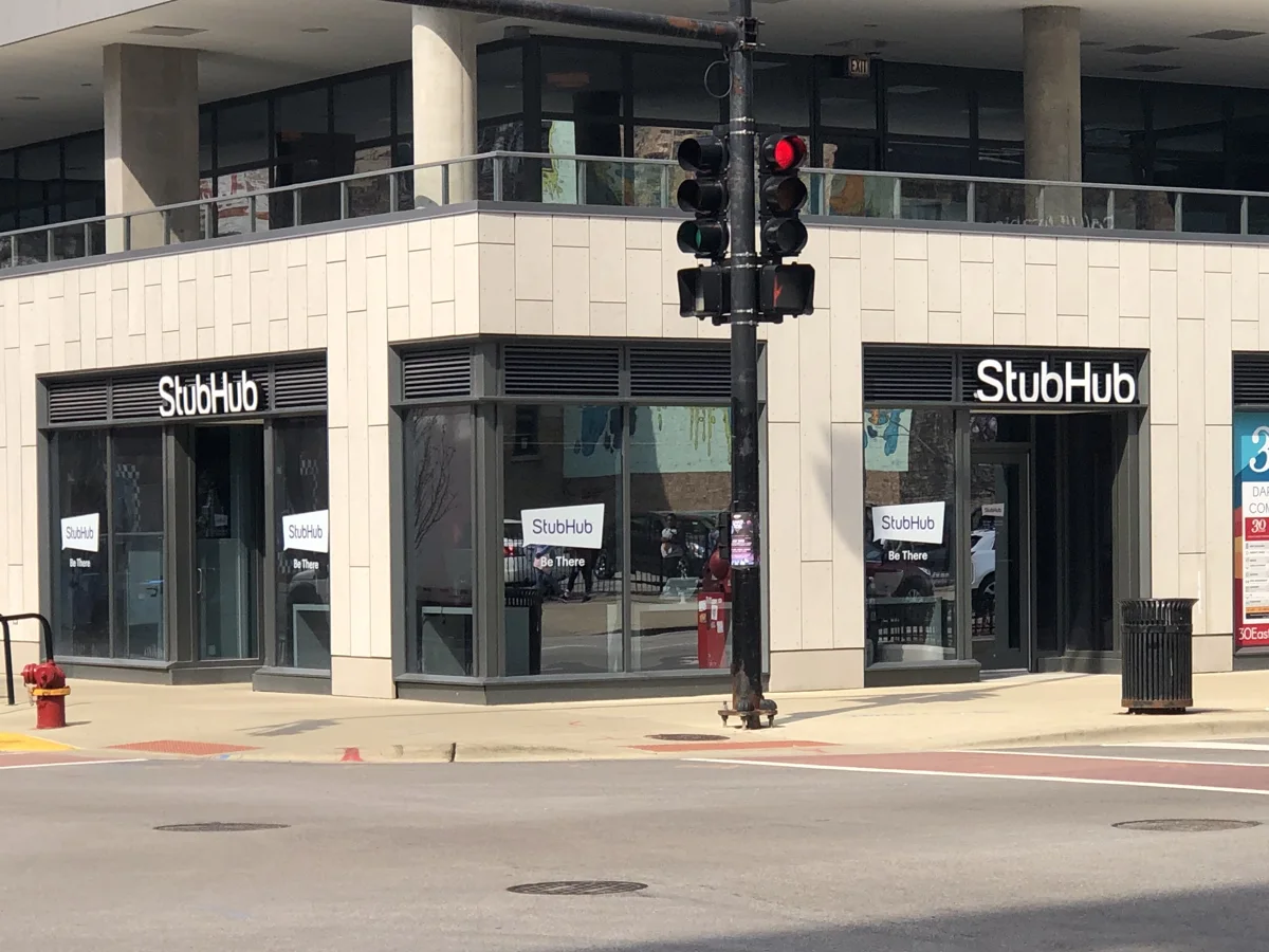 White StubHub storefront lettering above glass doors on a Chicago street corner